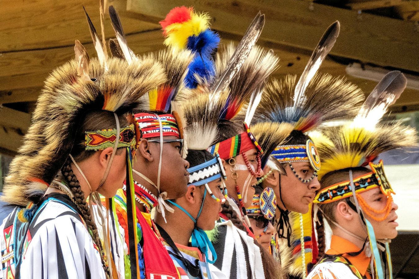 Native Lumbee men stand in traditional head wear prior to a performance inn Lumberton, North Carolina.