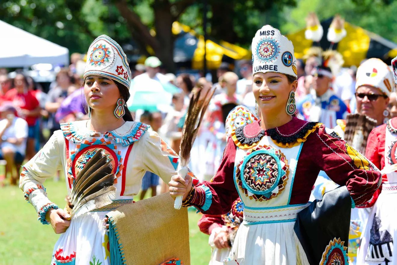 The Lumbee Tribe Homecoming Queen stands in traditional native wear during the Lumbee Homecoming Festival in Lumberton, North Carolina. 