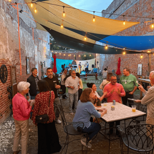 Band in The Alley, people attending during Art Stroll