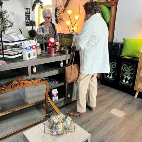 Customer buying item at Rosewood Antiques.