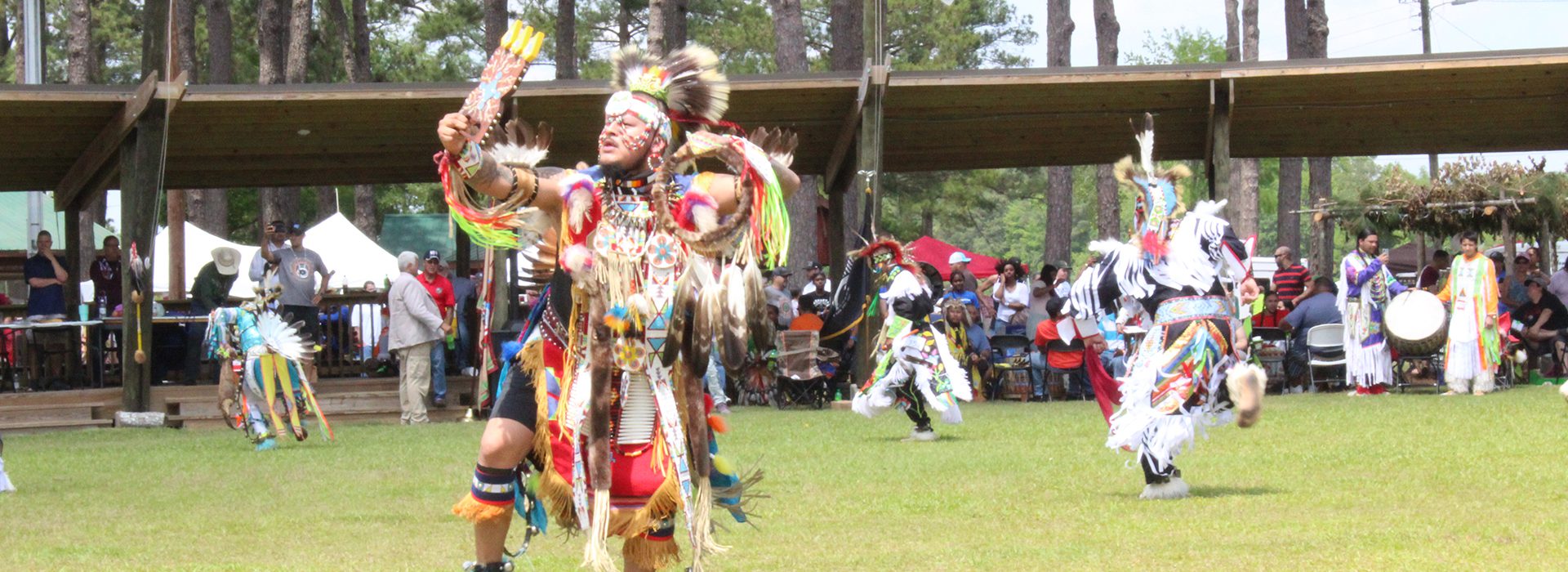 Members of the Lumbee Tribe are dressed in colorful and traditional dance apparel during a performance at the Lumbee Tribe Homecoming in North Carolina.  