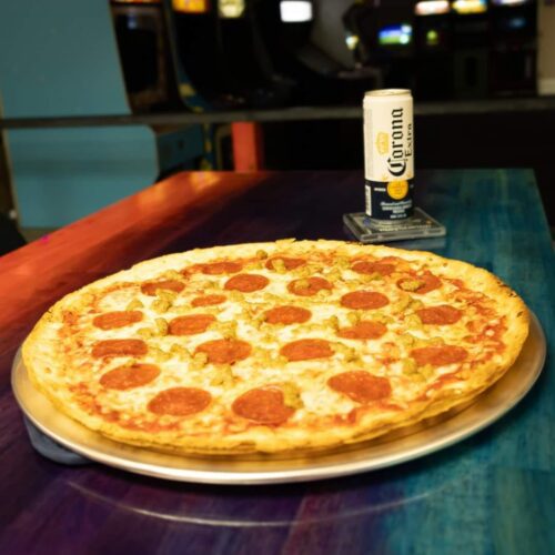 Closeup of pepperoni pizza and a Corona Extra in a can at Retro City in Lumberton, NC